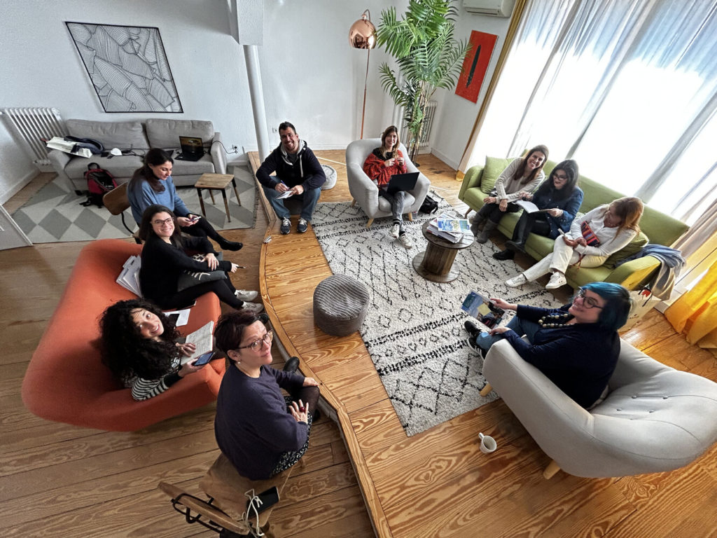 Carrani Tours team in a pre-event meeting at the Calle Fuencarral apartment in Madrid before the FITUR fair.